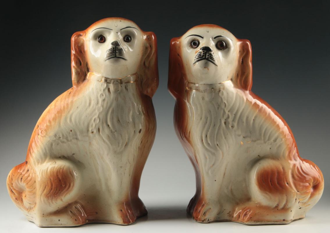 A PAIR 13-INCH 19TH C. STAFFORDSHIRE SPANIEL FIGURES