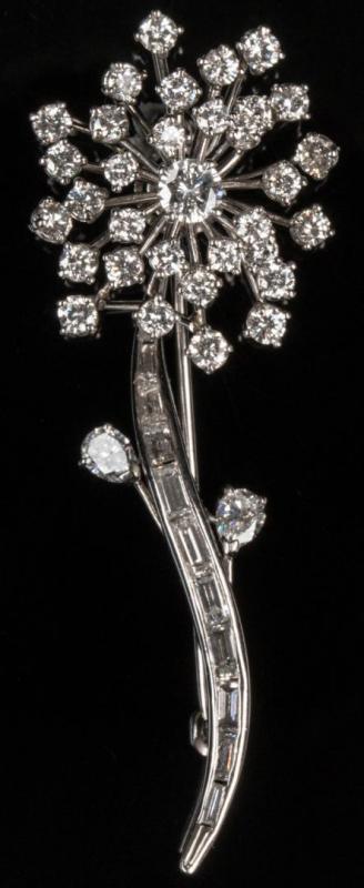 AN OSCAR HEYMAN DIAMOND AND PLATINUM FLOWER FORM PIN