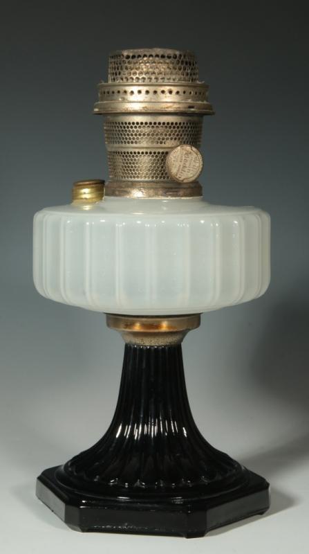 AN ALADDIN 'CORINTHIAN' MOONSTONE OVER BLACK LAMP