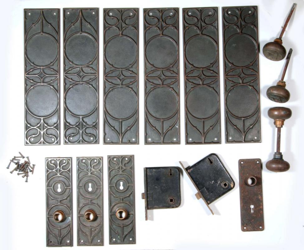 A SET OF ANTIQUE BRONZE DOOR HARDWARE