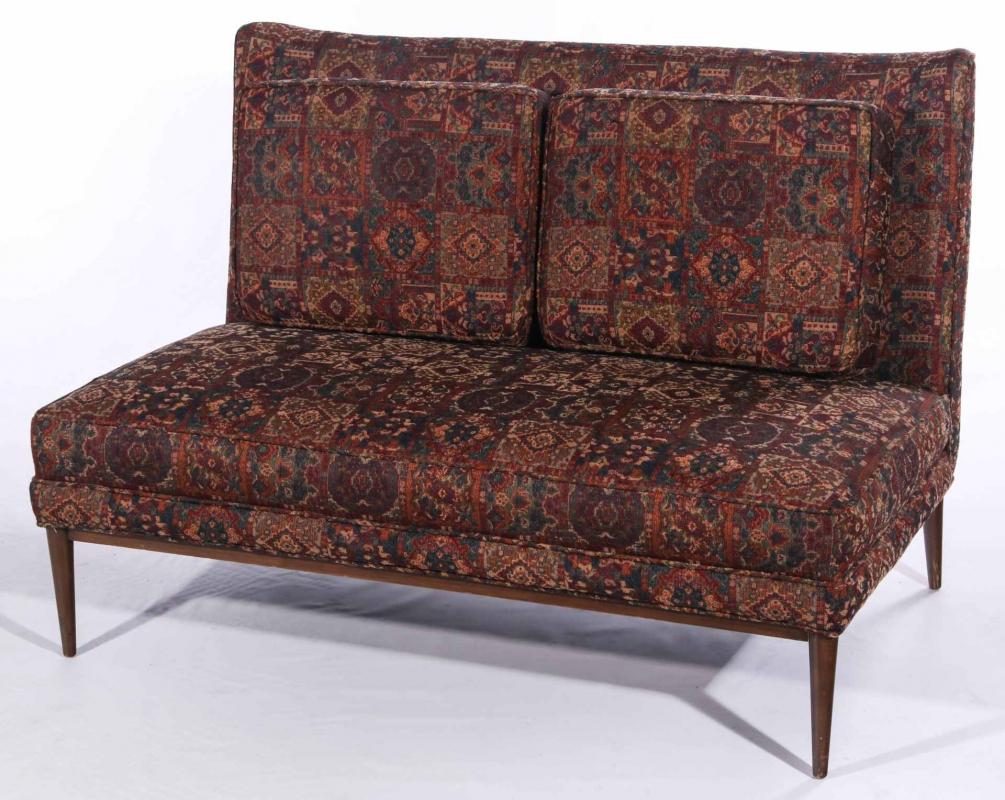 AN ARMLESS LOVE SEAT ATTRIBUTED TO PAUL MCCOBB