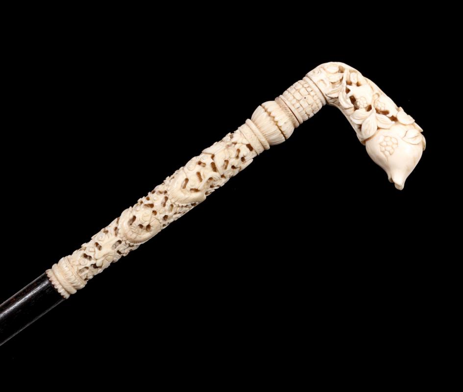 A 19TH C WALKING STICK WITH FINELY CARVED IVORY 