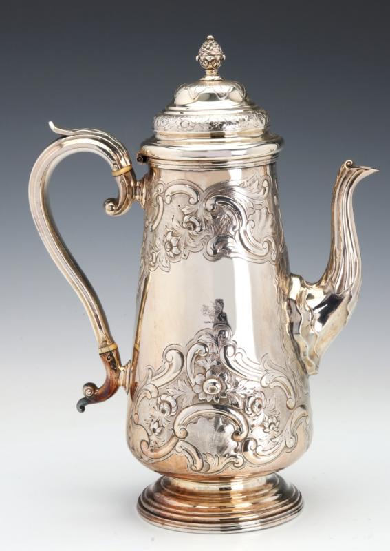 A 19TH CENTURY SILVER PLATED REPOUSEE COFFEE POT