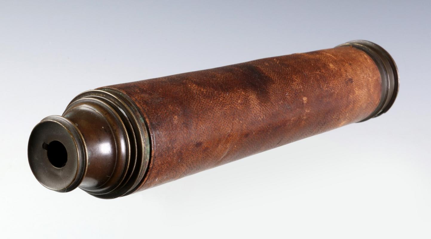 A 19TH C. TWO-DRAW BRASS TELESCOPE WITH LEATHER