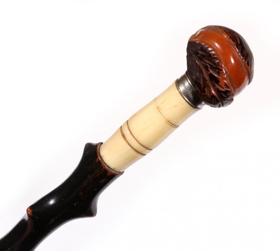 A CIRCA 1900 COQUILLA AND BONE WALKING STICK  