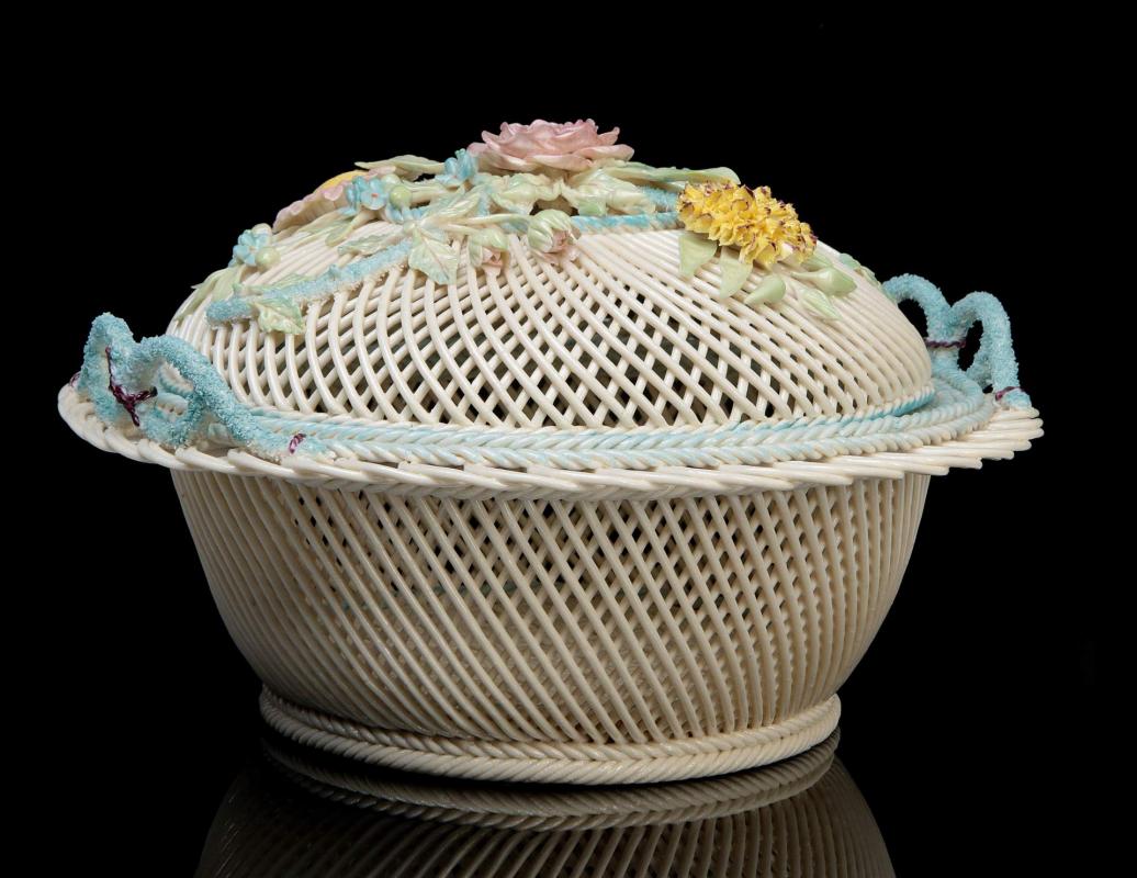 AN IRISH BELLEEK FOUR STRAND CIRCULAR LIDDED BASKET