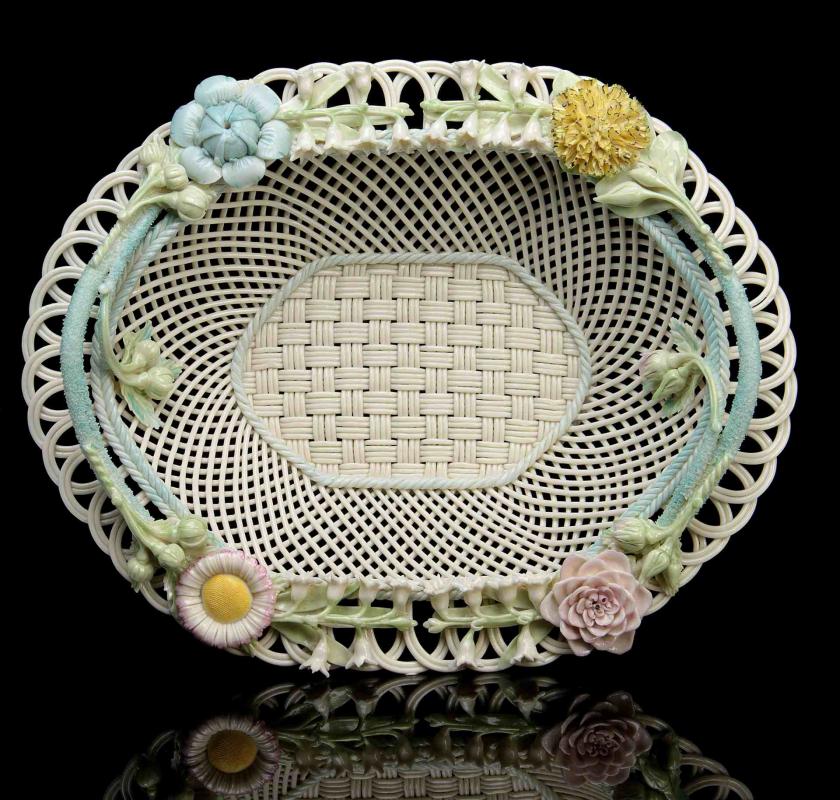 AN IRISH BELLEEK FOUR STRAND OVAL BASKET