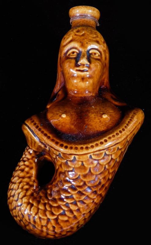 A 19TH C. BENNINGTON POTTERY MERMAID FLASK