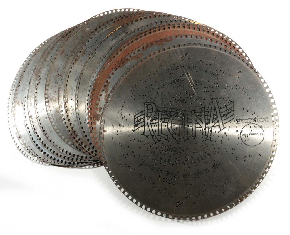 FOURTEEN 15.5 INCH REGINA MUSIC BOX DISCS