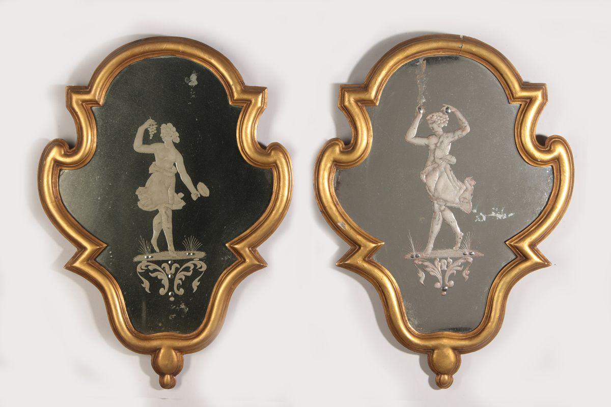 A PAIR OF 19TH C. CARTOUCHE FORM INTAGLIO MIRRORS 