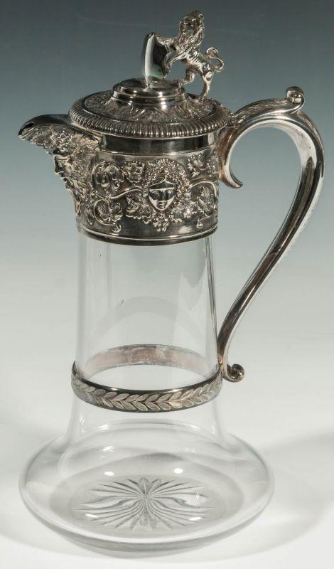 A SILVER MOUNTED BACCHANALIA THEME CRYSTAL FLAGON