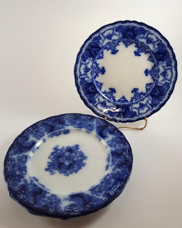 FOUR ASSORTED FLOW BLUE PLATES