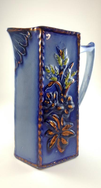 A CIRCA 1900 FLOW BLUE PITCHER