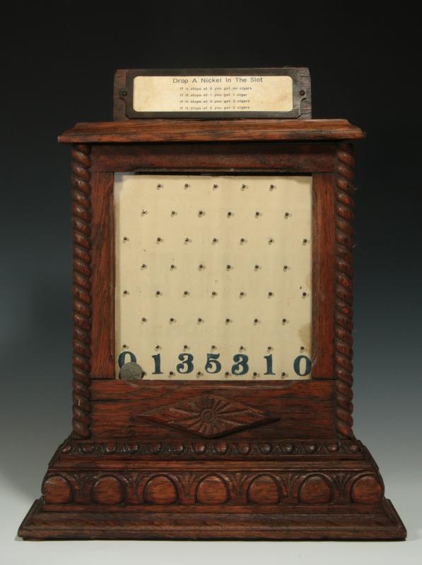 A 19THC OAK COIN DROP CIGAR STORE TRADE STIMULATOR