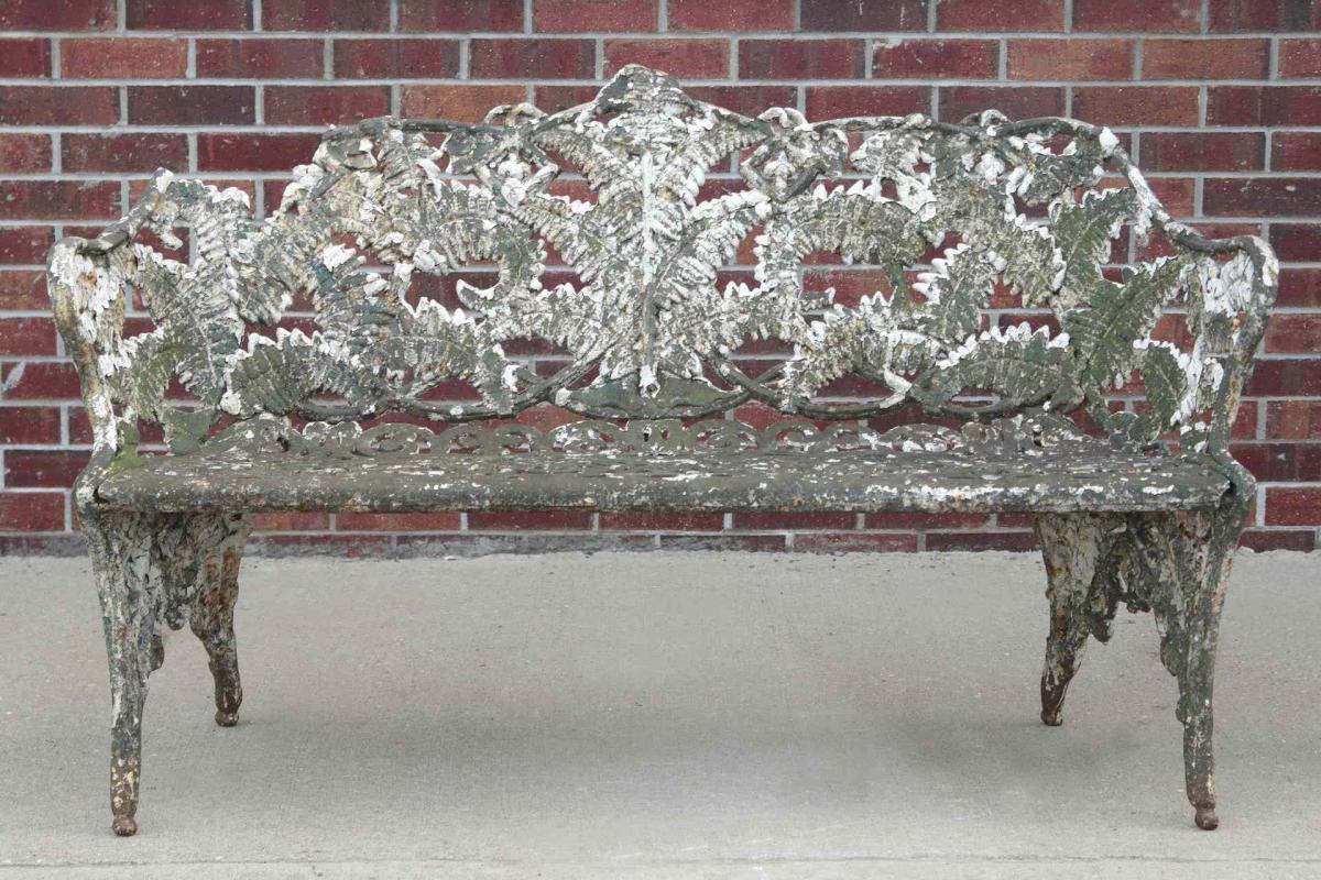 A VICTORIAN CAST IRON FERN PATTERN GARDEN BENCH