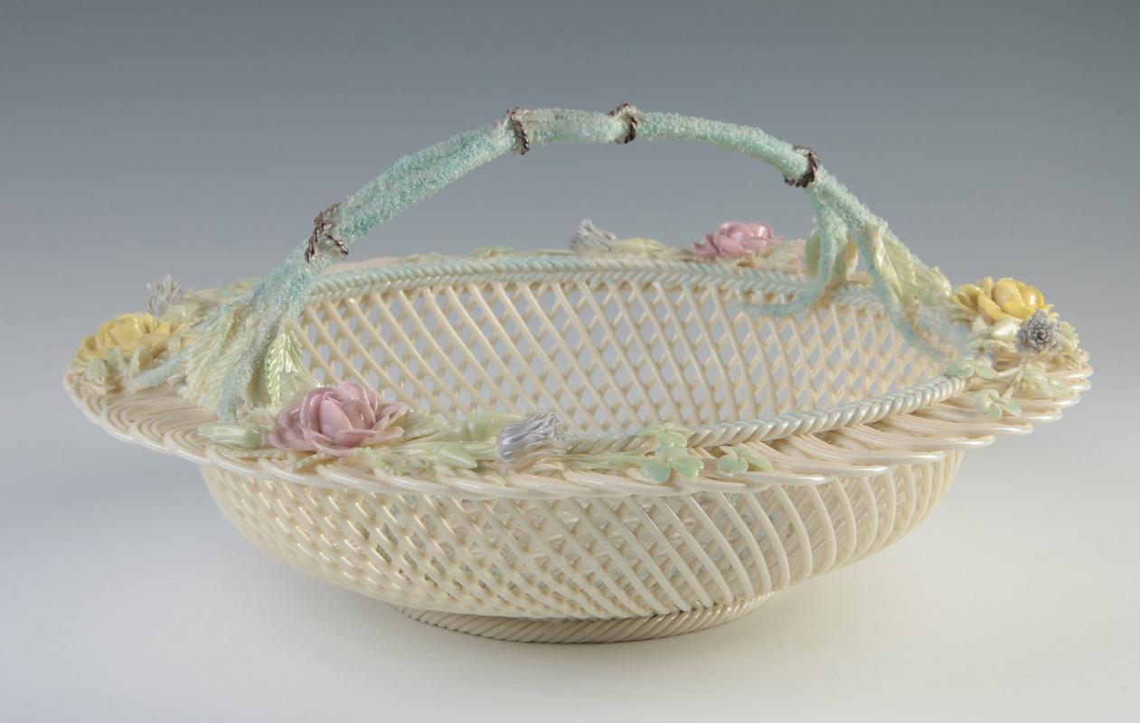 AN IRISH BELLEEK HENSHALL FOUR STRAND BASKET