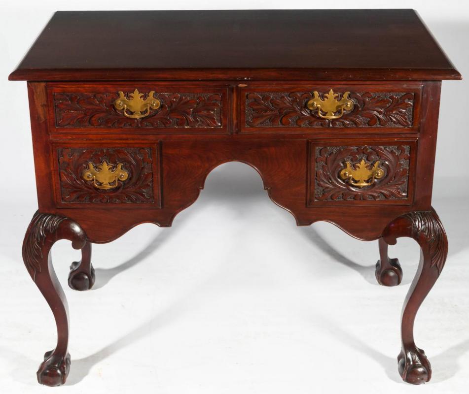 A LATE 19TH CENTURY CARVED MAHOGANY LOWBOY