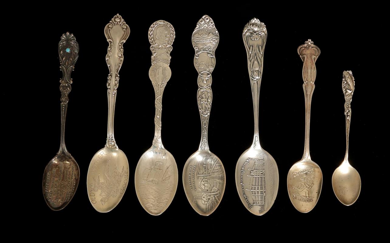 SEVEN ANTIQUE STERLING SILVER SOUVENIR SPOONS 